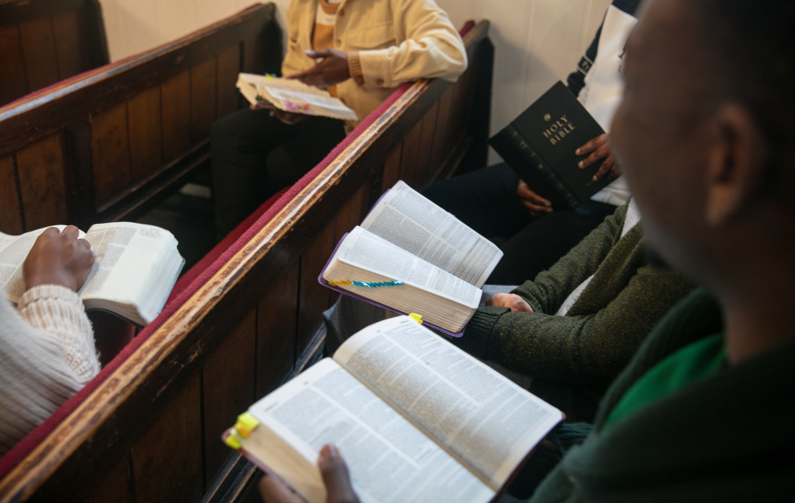 A group of Hermeneia students sitting in the Woodbridge Chapel discussing the Bible